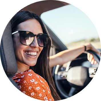 Girl in front seat of car driving
